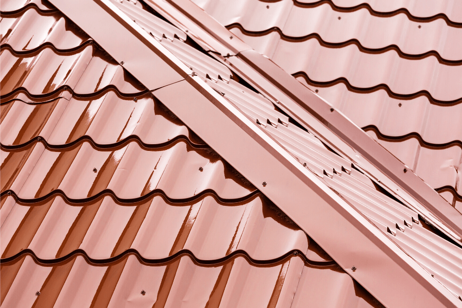 steel roofing. Close up image of rust red colored steel roof panels